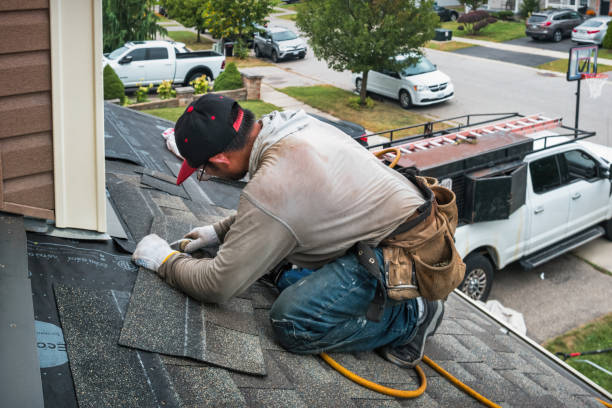 Professional Roofing technician working in East Walpole, MA